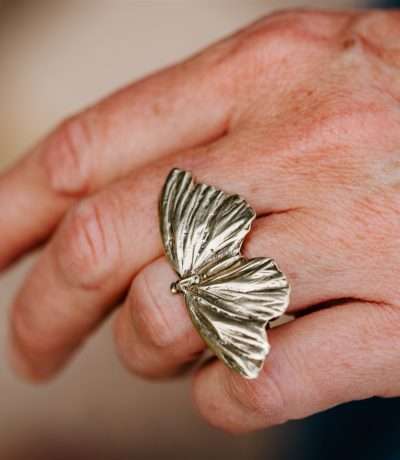brass butterfly ring on hand