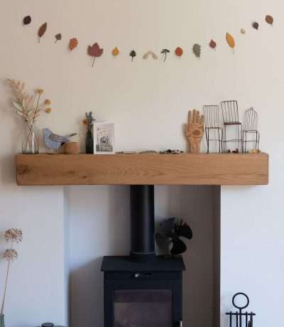 autumn leaves above fireplace main