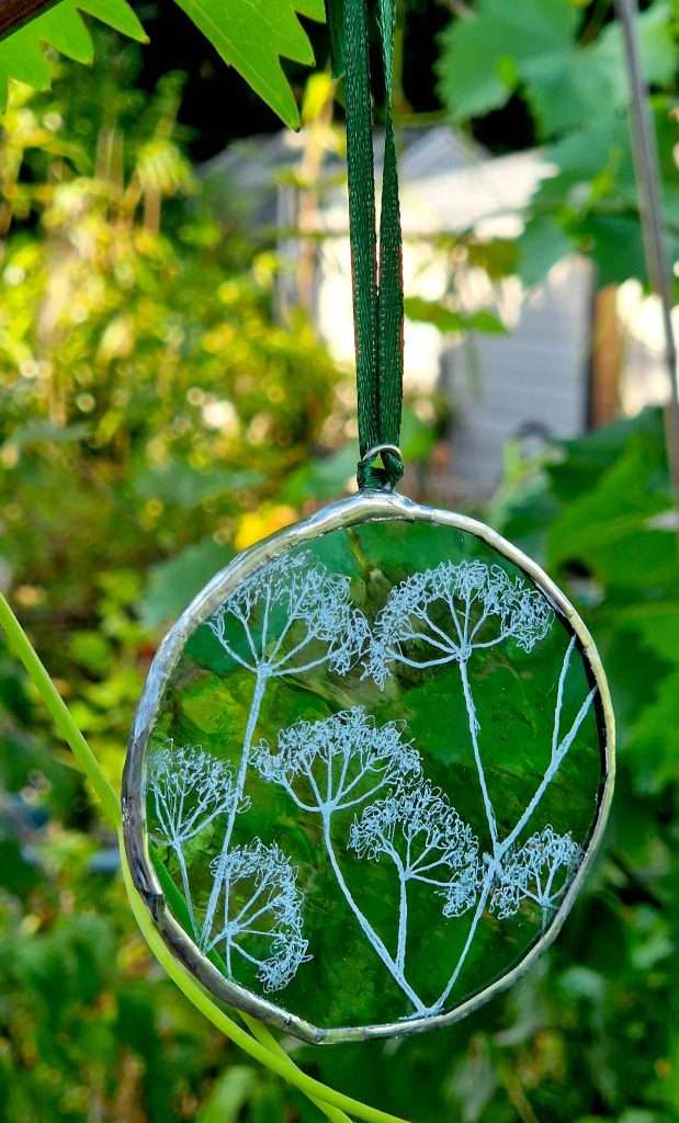 cow parsley on green glass frame