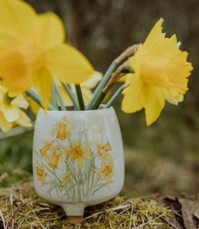 Daffodil footed vase landscape