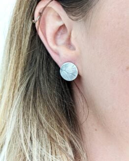 eco silver fern studs on ear