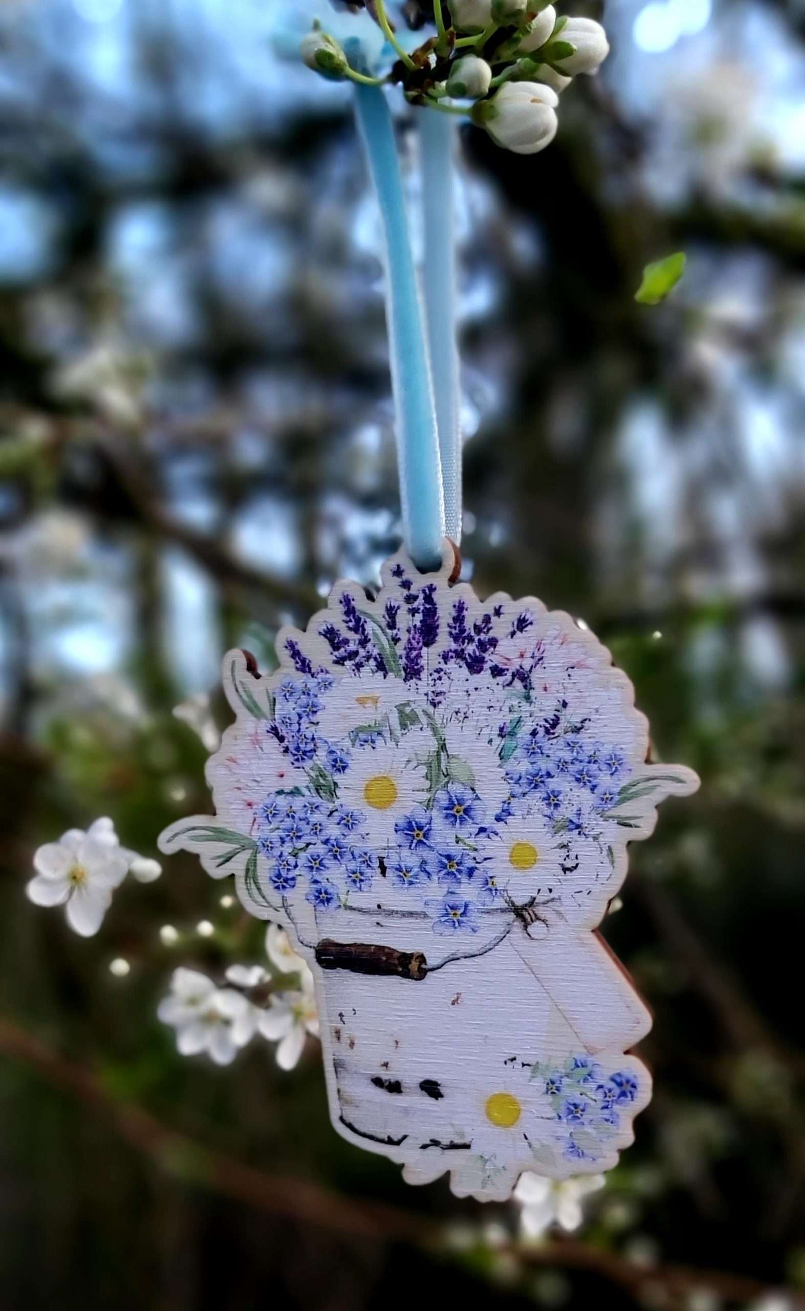 wooden blue flowers in bucket decoration