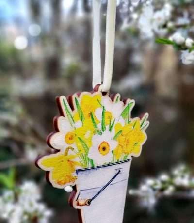 wooden daffodils in bucket